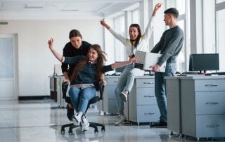 man holds printer having fun in the office young p QDFCE6T